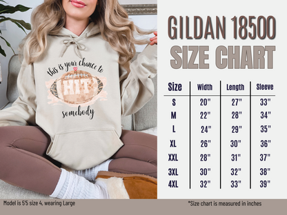 Person wearing a hoodie with text and a size chart for Gildan 18500 hoodies.